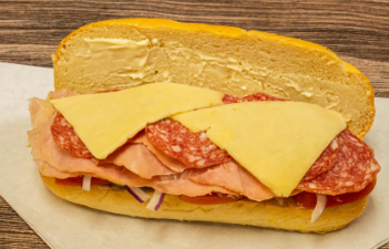 Close-up of fresh Banh Mi ingredients: pickled daikon, carrots, cilantro, and jalapeños.